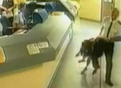 Sgt Mark Andrews drags Pamela Somerville through the Wiltshire police station.