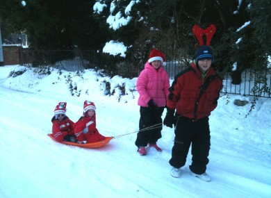 The school run must go on: Jack Hartnett (12) and sister Rachel (9) take over from Rudolph to give Lucy (5) and Joseph (3) a lift to their Christmas party.