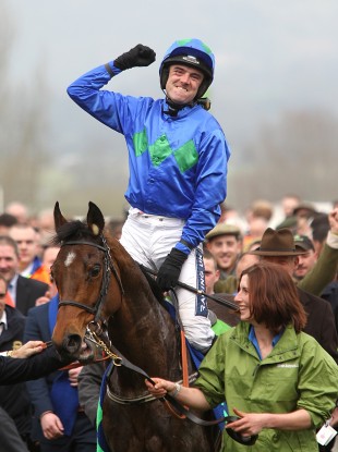 Ruby Walsh celebrates on Hurricane Fly after winning the Stan James Champion Hurdle Challenge Trophy on Centenary Day at Cheltenham.