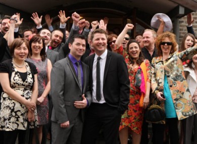 Hugh Walsh and Barry Dignam celebrate with friends and family after entering one of Ireland's first same-sex civil partnerships today.