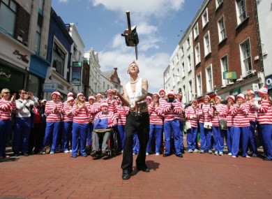 The Space Cowboy in Dublin juggles with a chain saw in front of a bunch of Wallys as he launch the Street Performance World Championship taking place next month.