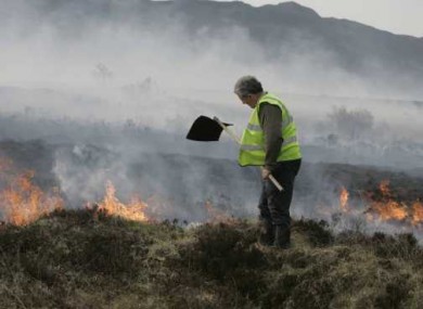 Coillte firefighter Tony Clarke battles a gorse fire outside Pontoon in Co Mayo.