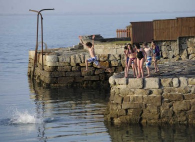 Swimmers enjoy the sun at Sandycove