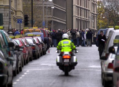 Taxi drivers park their taxis on Kildare Street during an industrial dispute. The Oireachtas has awarded a contract worth €300,000 for staff to be brought home if they work late.