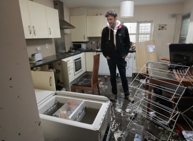 Parnell Road resident David Cahill surveys the damage on 25 October 2011.