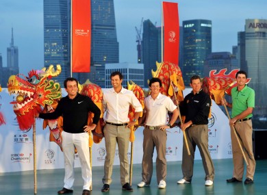 Francesco Molinari, Adam Scott, Rory McIlroy, Lee Westwood and Keegan Bradley of the United States perform traditional dragon dance at the opening ceremony.
