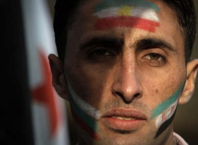 Fathi, 23, a Syrian refugee, attends a protest against the Syrian regime in Sofia, Bulgaria, 6 Nov 2011.