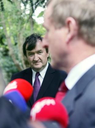 David Gunning looks on as Taoiseach Enda Kenny speaks to the media in September.