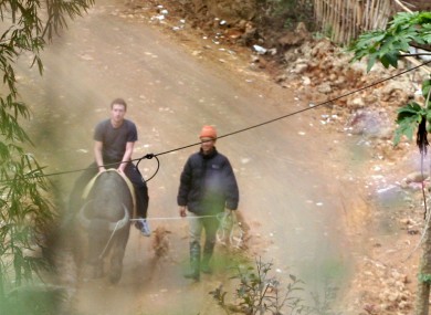 Zuckerberg rides a water buffalo in northern resort town of Sapa in Lao Cai province in Vietnam on 26 December.