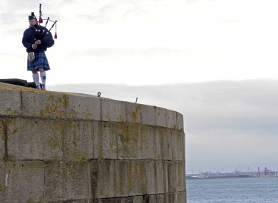 Piper Paul McNally plays at a memorial ceremony for those who have lost their lives at sea.