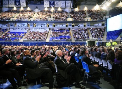 Members of the audience applaud at the conclusion of a video montage featuring moments from former Penn State head football coach Joe Paterno's career.