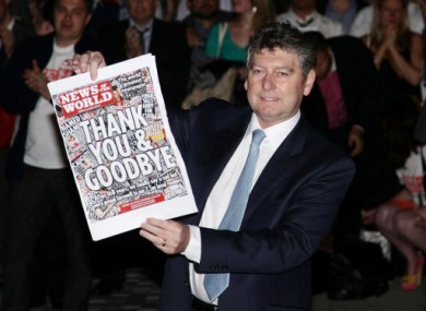 Myler with the final copy of the News of the World following the phone hacking scandal which brought about the paper's demise.