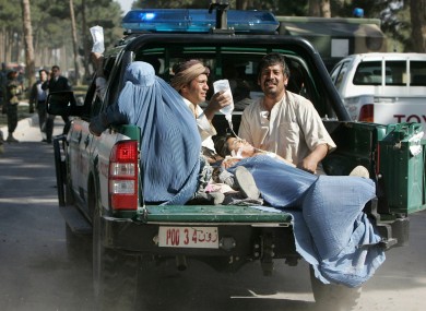 Afghan victims of the suicide attack are transported in the back of a police truck in Guzara, Herat province earlier today.