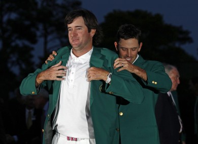 Bubba Watson tries on the famous green Augusta Masters blazer
