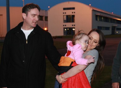 Ellie Madden and her parents after the toddler spent five months in Boston.