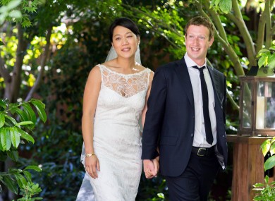 This photo provided by Facebook shows Facebook founder and CEO Mark Zuckerberg and Priscilla Chan at their wedding ceremony in Palo Alto, Calif., Saturday, May 19, 2012