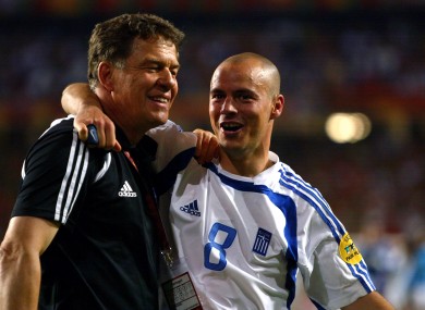 Greece coach Otto Rehhagel celebrates winning the UEFA European Championship with Stylianos Giannakopoulos.