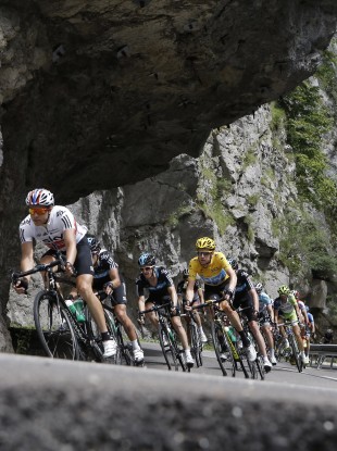 Bradley Wiggins follows teammate Edvald Boasson Hagen of Norway, left, as they speed down Granier pass.