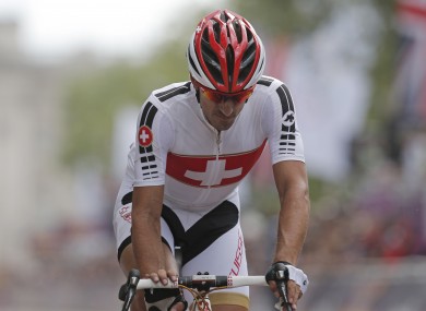 Switzerland's Fabian Cancellara crosses the finish line after completing the Men's Road Cycling on Saturday.
