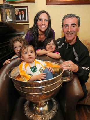 Manager Jim McGuinness with his family, wife Yvonne, and kids Toni-Marie, Michael Anthony and Jim Jr in the Sam Maguire Cup.