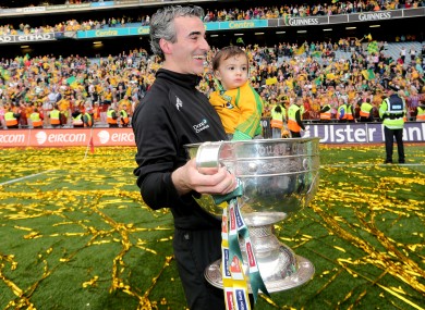 McGuinness with his son Jim Jr and Sam Maguire.