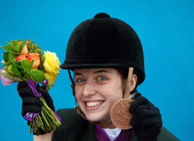 Kearney celebrates after winning a bronze medal in the dressage individual freestyle test - Grade Ia.