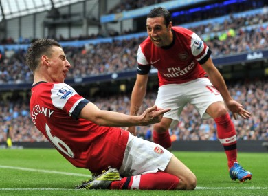 Koscielny celebrates scoring with Santi Cazorla.