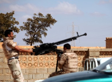 Soldiers from the Libyan National Army get ready to enter Rafallah al-sahati Islamic Militia Brigades compound in Benghazi.