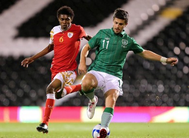 Ireland's Shane Long and Raed Saleh of Oman.