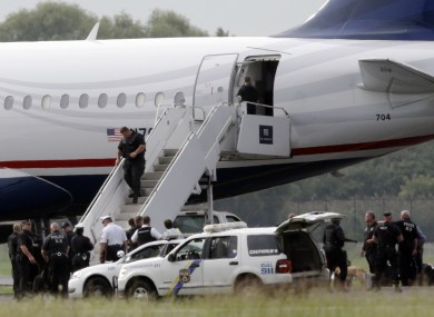 Law enforcement at the plane when it returned to the airport in Philadelphia today.