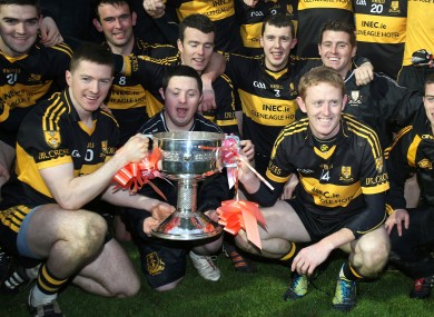 Dr Crokes Kieran O'Leary and Colm Cooper lift the trophy aloft.