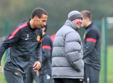 Ferdinand and manager ALex Ferguson at training today.