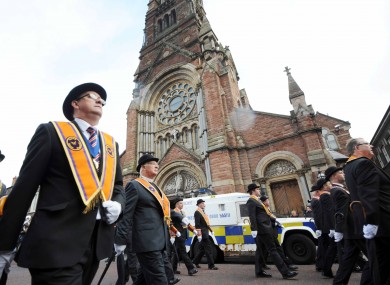 The parade passing St Patrick's Church on Donegall Street.