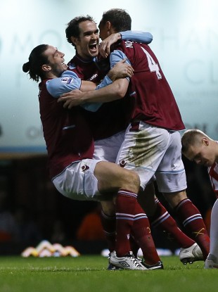 O'Brien is congratulated by Andy Carroll and Kevin Nolan.