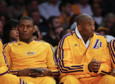 Los Angeles Lakers' Kobe Bryant, right, and Metta World Peace on the bench.