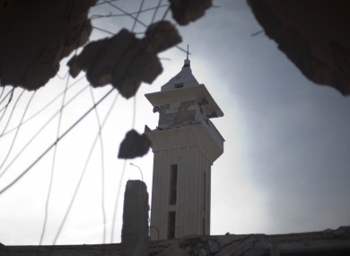A minaret is seen though the damage of a destroyed mosque in town of Taftanaz, on the outskirts of Idlib, Syria, on Friday.