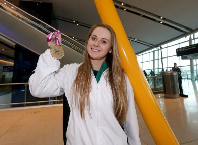 Sycerika McMahon shows off her bronze medal at Dublin Airport.
