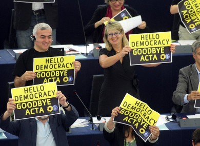 Green MEPs cheer after the European Parliament voted down the controversial Anti-Counterfeit Trade Agreement.