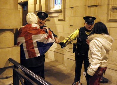 Loyalists clash with PSNI officers after the council voted on the motion on the British flag