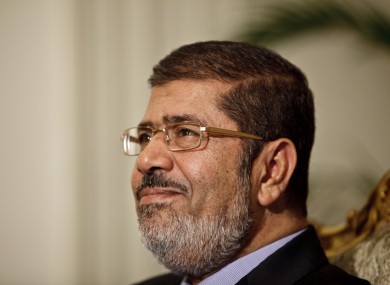 Egyptian President Mohammed Morsi is seen during a photo opportunity in his office at the presidential palace in Cairo yesterday