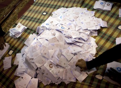 Egyptian election workers count ballots at the end of the second round of a referendum on a disputed constitution drafted by Islamist supporters of president Mohammed Morsi
