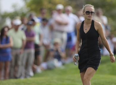 Wozniacki follows McIlroy on the golf course recently.