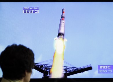 A TV news report shows a computer generated image of North Korea's long-range rocket, which failed after its first launch in April.