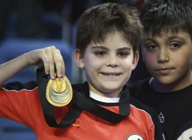 Arda Cakmak poses with the gold medal handed to him by U.S. Ryan Lochte on Friday.