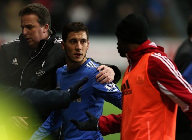 Chelsea's Eden Hazard leaves the pitch after being sent off.