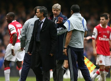 Arsenal manager Arsene Wenger tries to speak with Jose Mourinho when he was Chelsea manager.