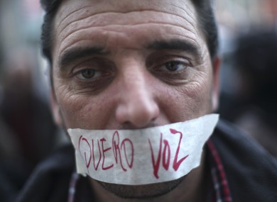 Portuguese worker Luis Silva at an anti-austerity protest last month. The tape over his mouth reads: