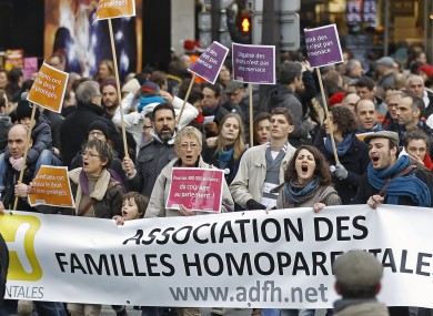 FILE: People demonstrate in support of the government project to legalize same-sex marriage and adoption for same-sex couples in Paris.