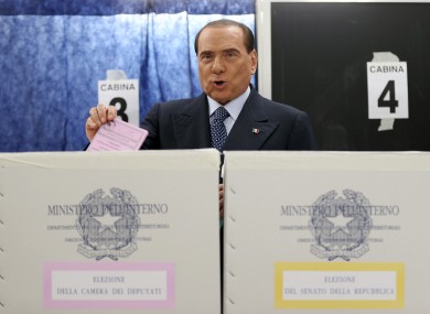 Former Premier Silvio Berlusconi casts his ballot in Milan today