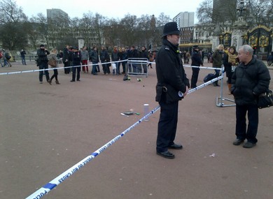 A cornered off area containing knives, a hat and Taser wire outside Buckingham Palace.